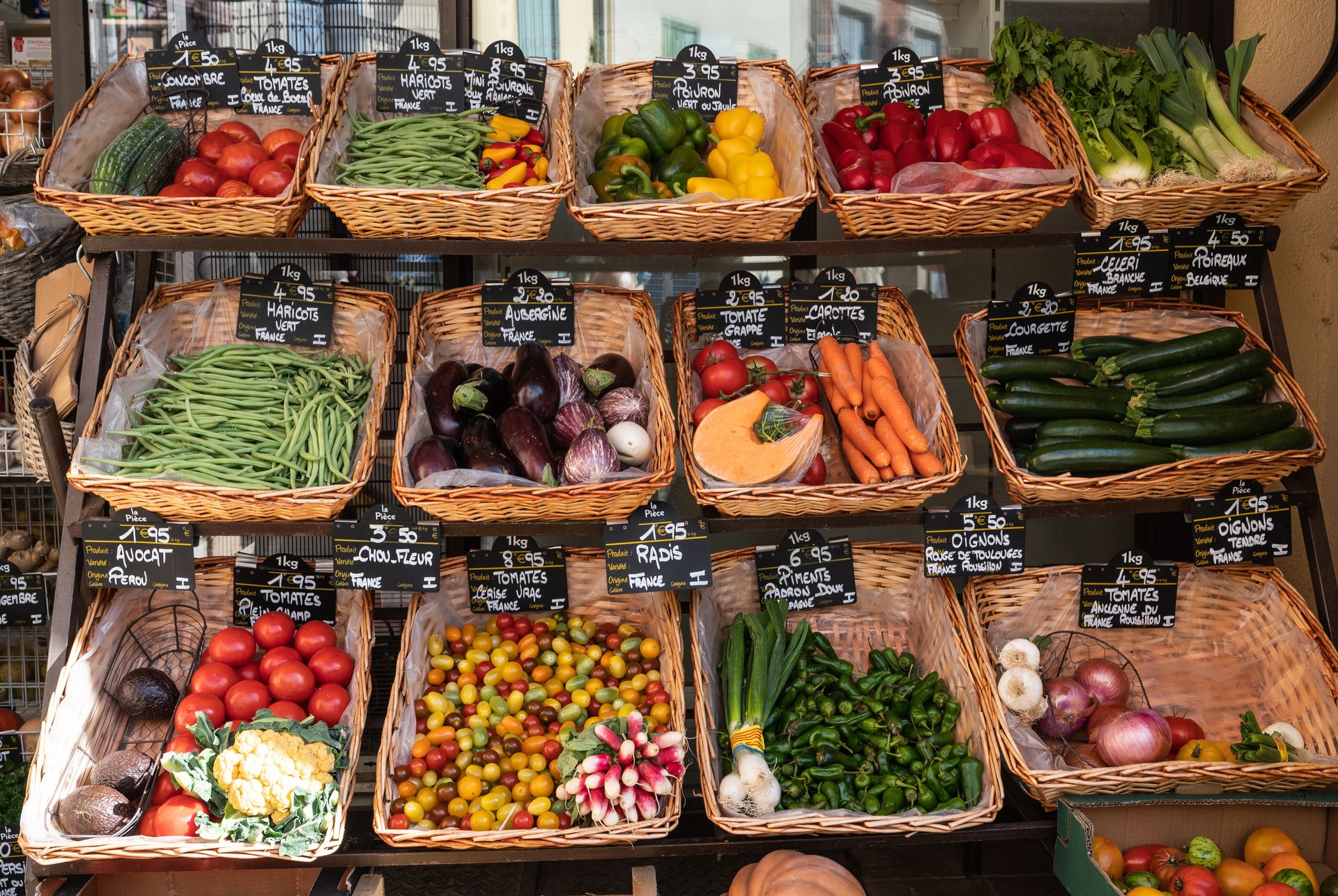 Vendor counter with colorful fruits and vegetables